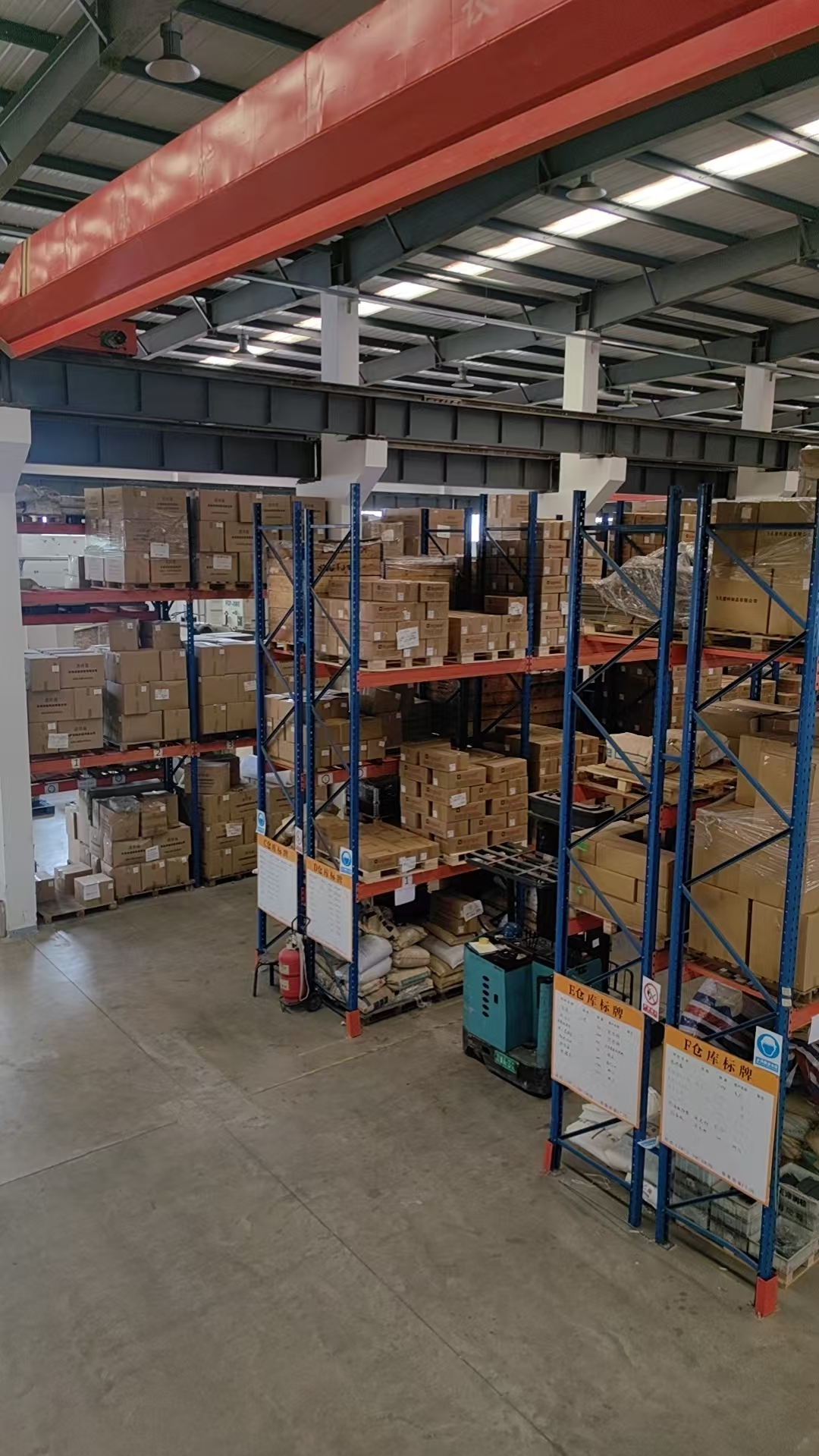 Organized warehouse racks inside the Tianjin factory